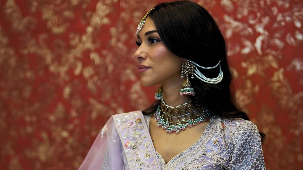 Idil Ci wearing traditional Desi fashion jewelry
