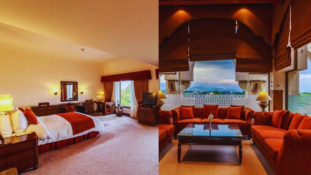 A regal king suite with deep red accents and iconic window views at the Islamabad Serena, one of the top staycation spots in Pakistan.
