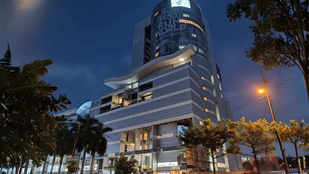 Eid Shopping in Dhaka at Bashundhara City featuring fashion stores, festive outfits, and busy shopping crowds.