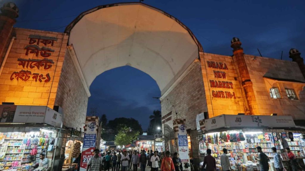 Eid Shopping in Dhaka at New Market with traditional clothing stalls, accessories, and classic shopping atmosphere.