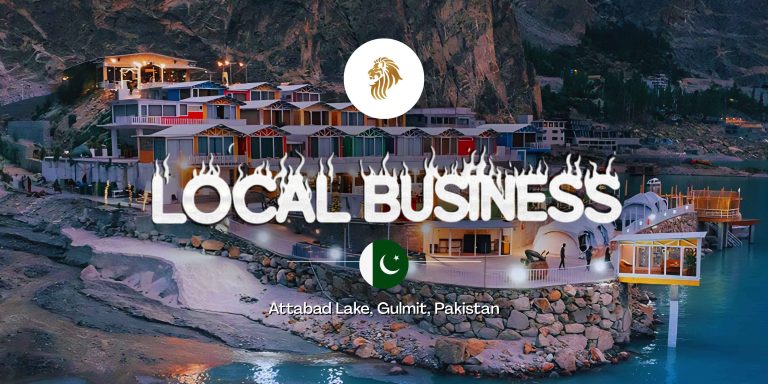 Exterior view of the colorful Luxus Hunza resort pods and architectural design overlooking the turquoise waters of Attabad Lake in Pakistan.