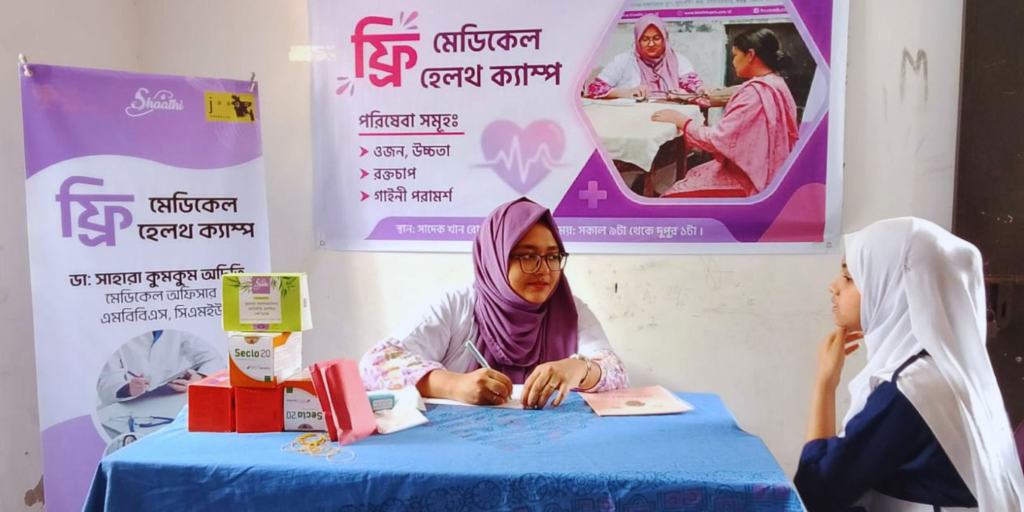 A female doctor conducting a private consultation with a student at SHaahti Foundation's initiative with JAAGO focused on breaking stigma and improving menstrual health in Bangladesh.
