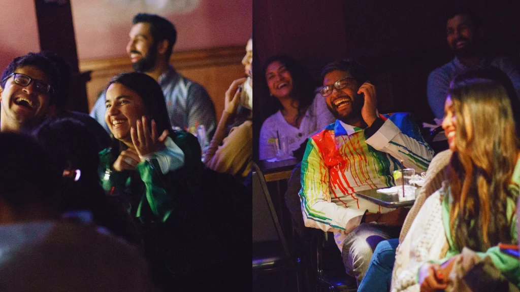 Audience members laughing and enjoying live stand-up comedy performances featuring Ali Mehedi at a South Asian comedy festival in NYC.